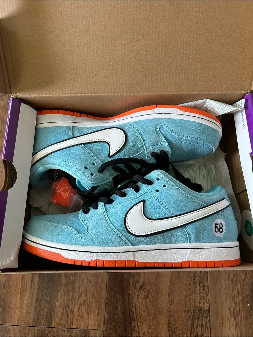 Nike Dunk Low Light Blue with White Swoosh and Orange Outsole
